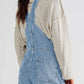 Light-wash pocketed square neck wide strap denim overalls with rolled cuffs
