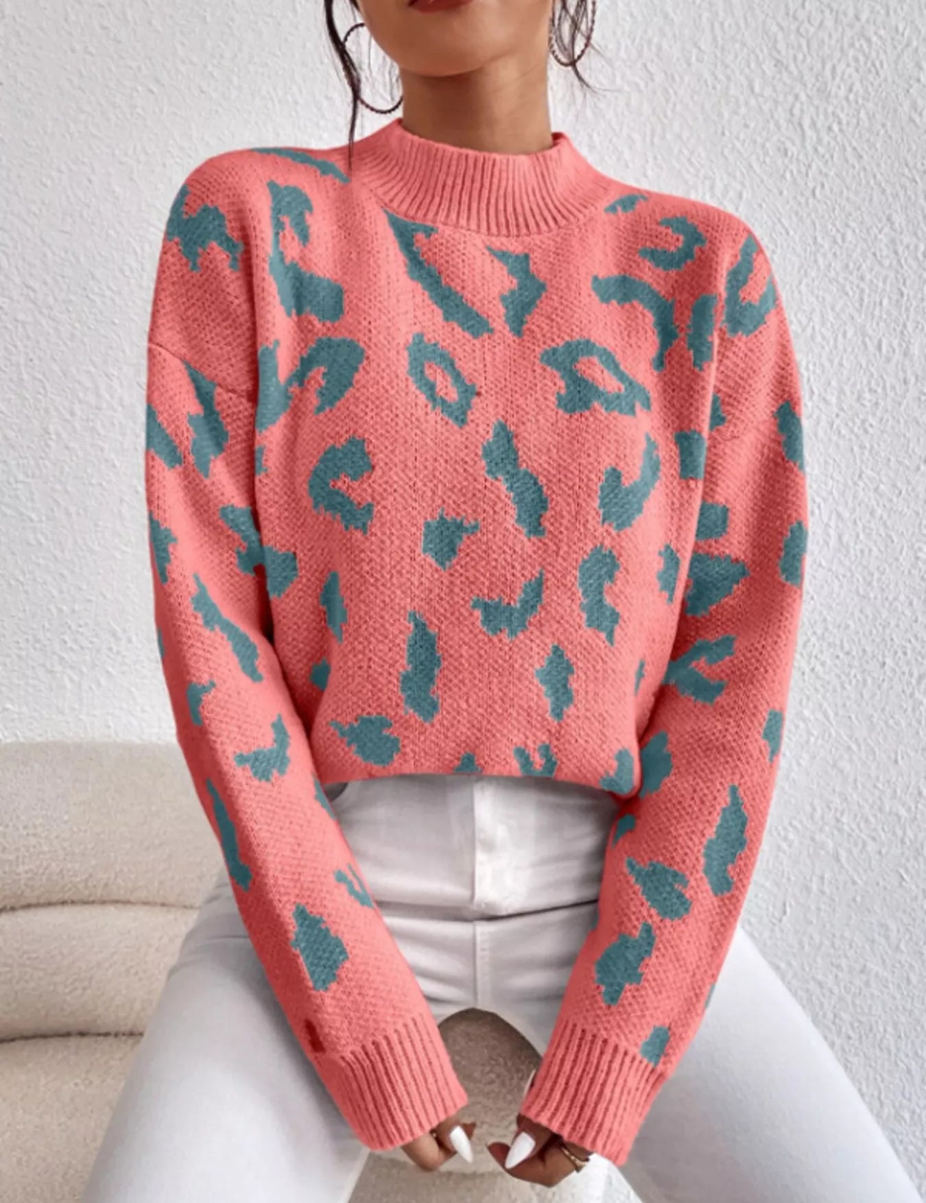 Leopard mock neck sweater in coral and teal with ribbed knit texture