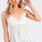 White lace-trimmed Mittoshop crisscross back V-neck cami with crochet peplum