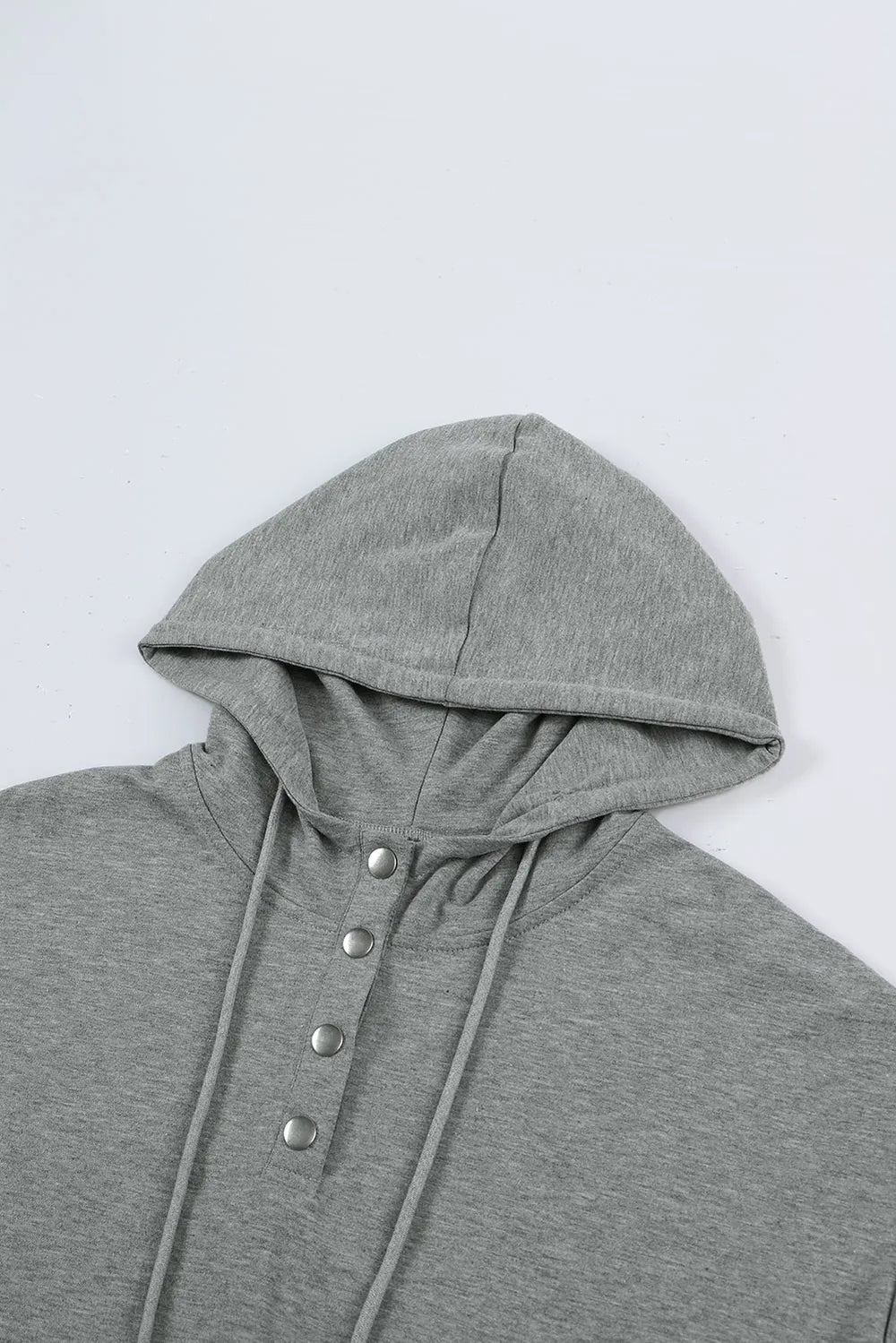 Gray drawstring quarter snap cap sleeve hoodie with silver buttons
