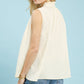 Umgee sleeveless textured split neck top in cream with ruffled high neckline