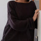 Boat neck dropped shoulder sweater in soft dark charcoal knit with loose fit and wide sleeves
