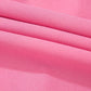 Vibrant pink high-waisted bootcut pants with soft smooth fabric folds
