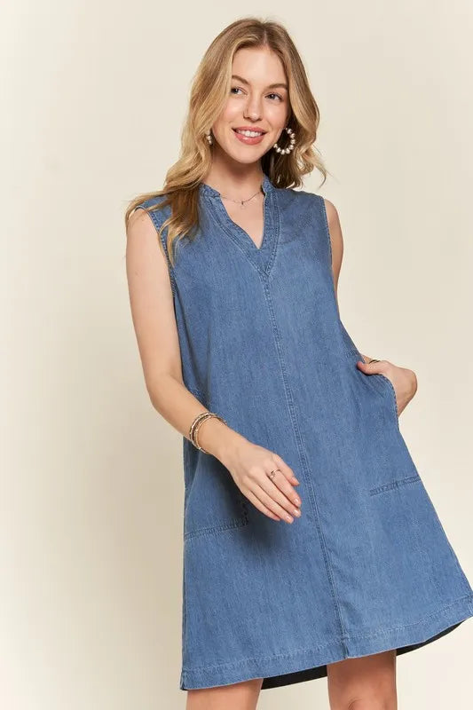 ADORA notched sleeveless denim dress in medium blue wash with pockets