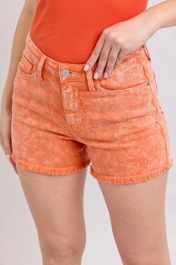 Judy Blue Peach mid rise denim shorts with orange distressed frayed hem and button closure