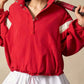 Red athletic jacket with white accents, silver snaps, half snap drawstring hem