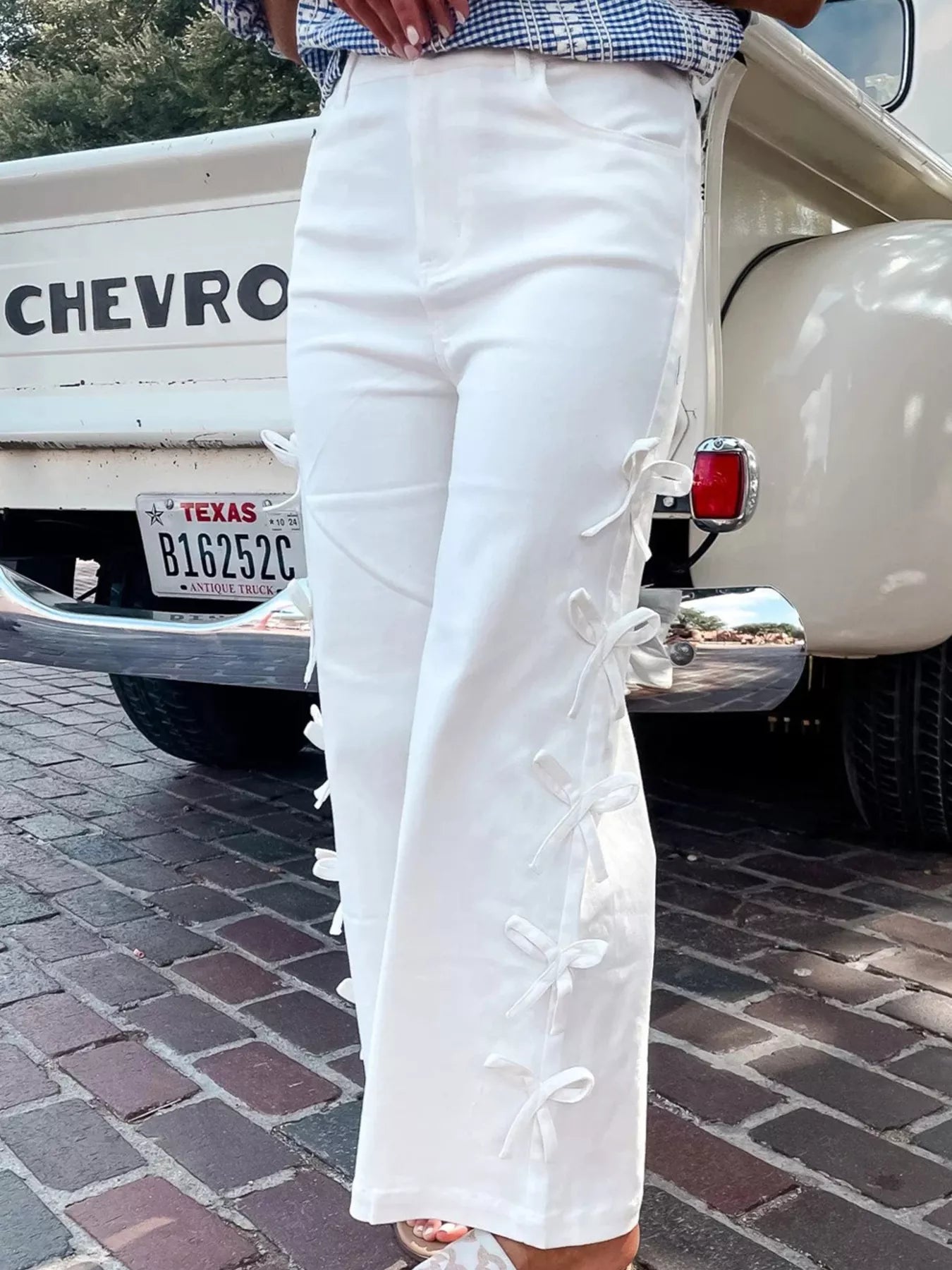 Daverri Fashions white wide-leg pants with bow-accented side ties