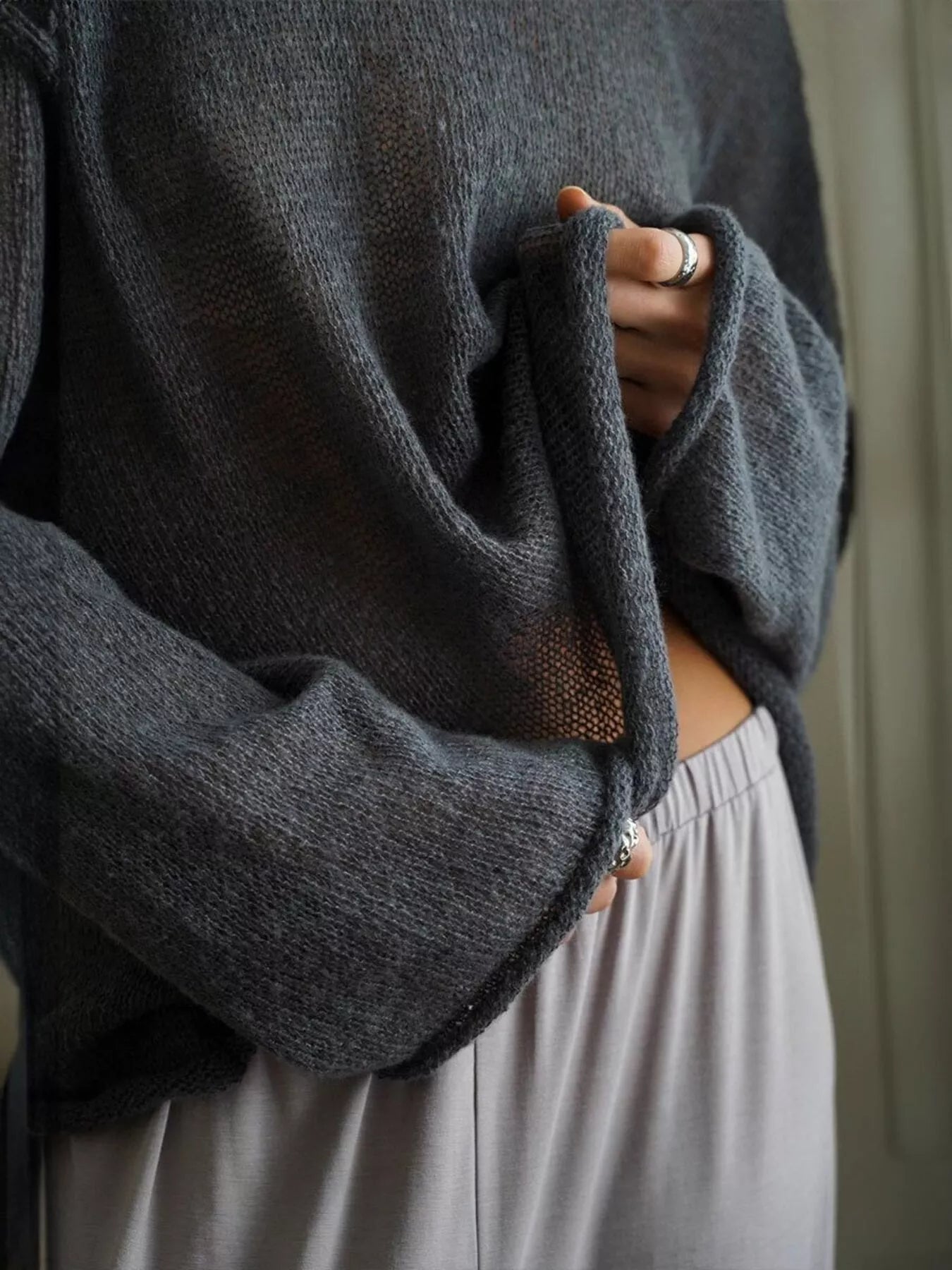 Soft dark gray boat neck dropped shoulder knitted sweater