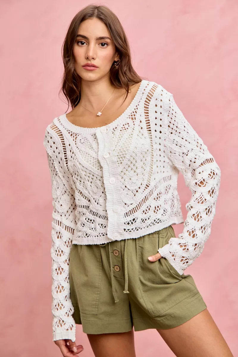 White crochet cardigan with lace patterns on SO ME twill shorts
