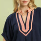 Umgee navy blue linen V-neck blouse with peach trim