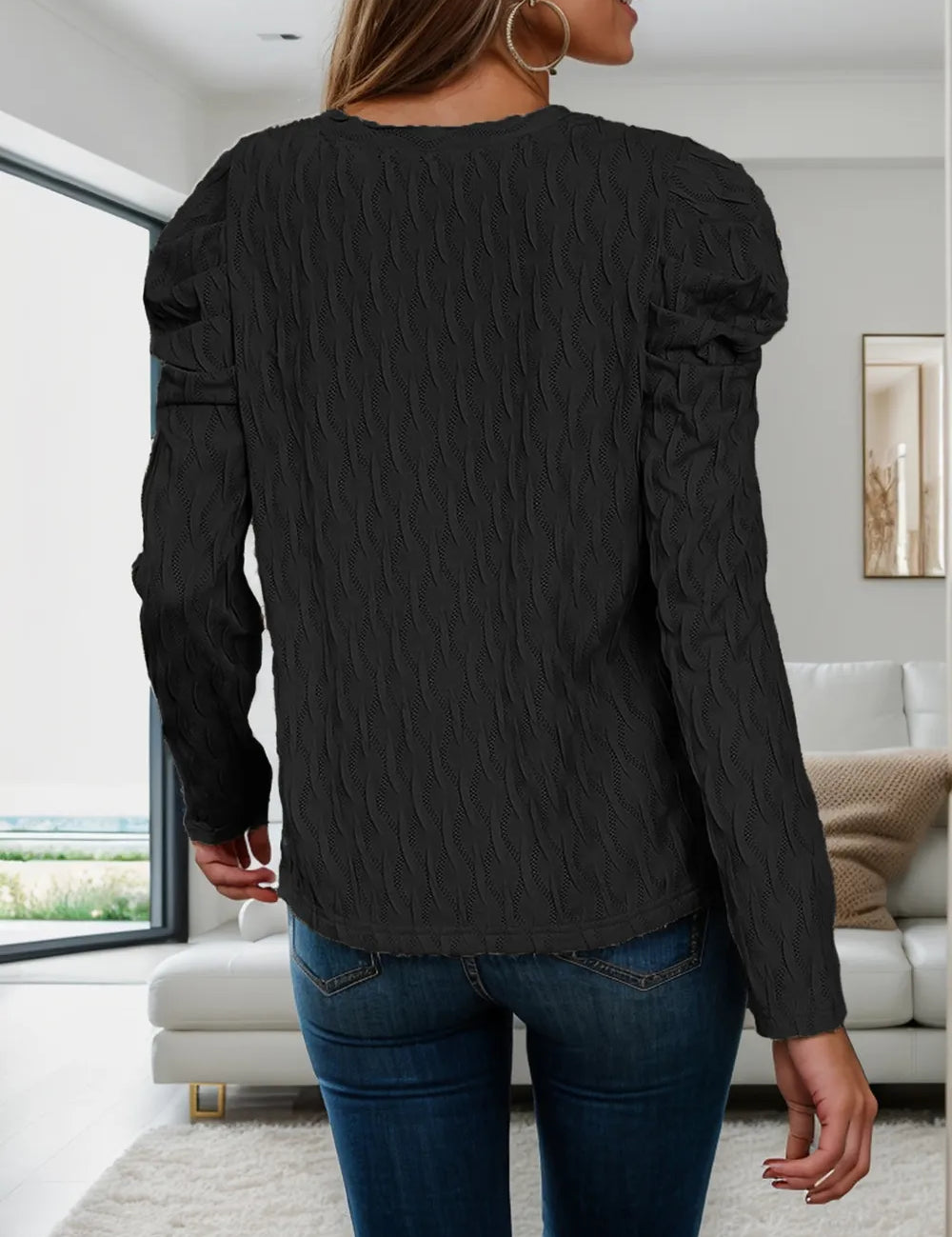 Black textured V-neck blouse with cutout shoulders and long puff sleeves