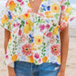 Floral boxy fit ruffled short sleeve blouse with vibrant blossoms