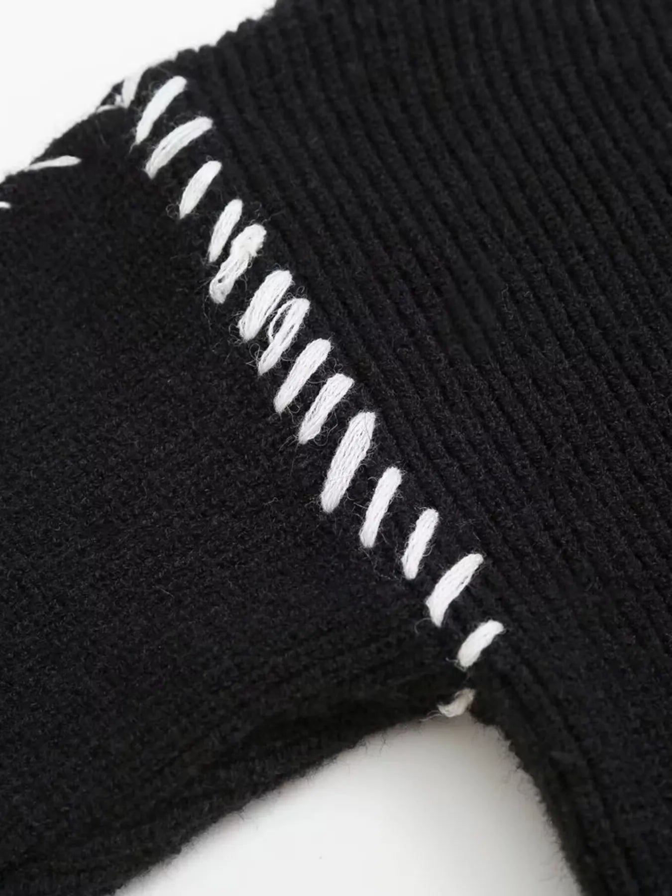 Black ribbed knit socks with white stitching detail