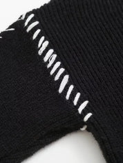 Black ribbed knit socks with white stitching detail