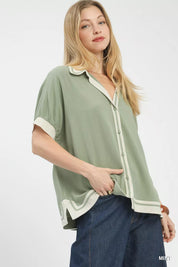 Mint green Umgee linen button front blouse with white contrast trim