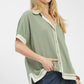 Mint green Umgee linen button front blouse with white contrast trim