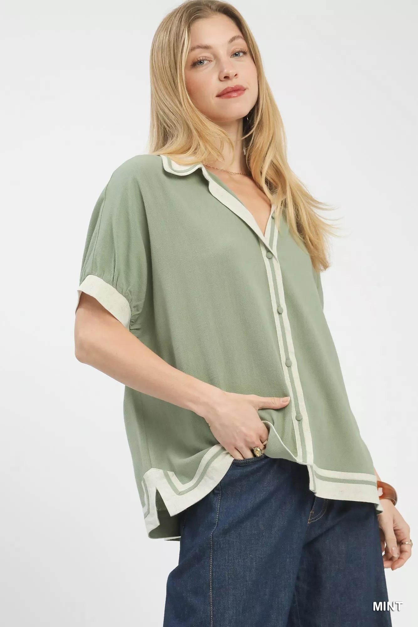 Mint green Umgee linen button front blouse with white contrast trim