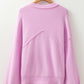 Pink raw edge ribbed drop shoulder sweater in soft lavender knit