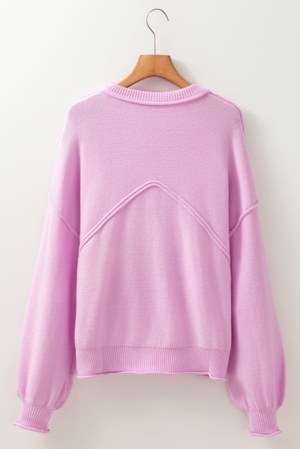 Pink raw edge ribbed drop shoulder sweater in soft lavender knit