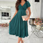 Emerald green satin surplice midi dress with V-neck and puffed sleeves