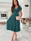 Emerald green satin surplice midi dress with V-neck and puffed sleeves