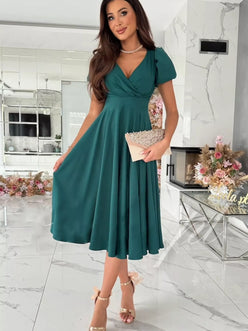 Emerald green satin surplice midi dress with V-neck and puffed sleeves