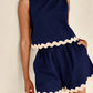 Daverri Fashions navy blue sleeveless top and shorts set with cream trim