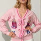 Double Take Full Size Nutcracker Sequin Bow Decor Cardigan - DAVERRI FASHIONS