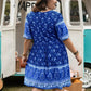 Plus size floral V-neck mini dress in blue print with short sleeves and fitted waist