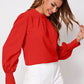 Vibrant red ruched mock neck long sleeve blouse with puffed sleeves