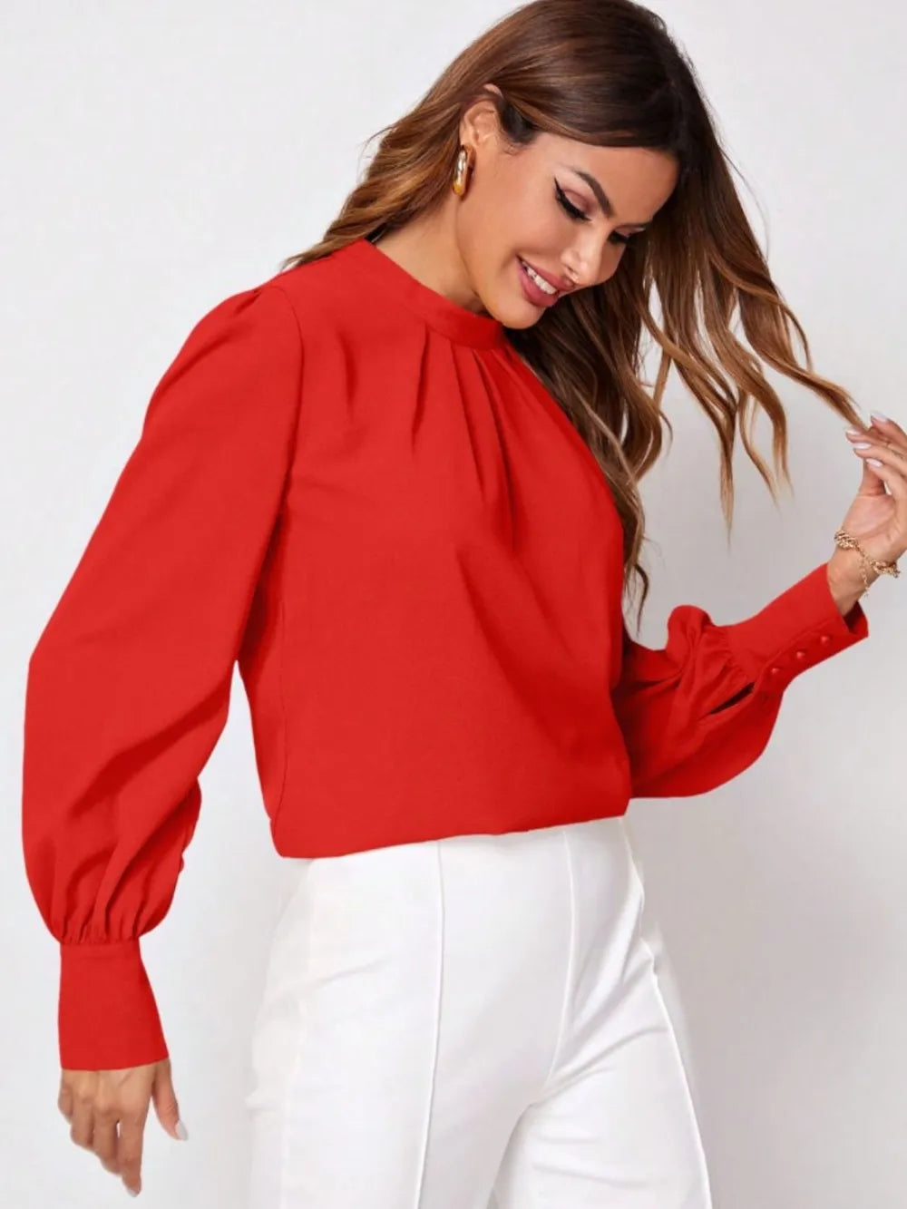 Vibrant red ruched mock neck long sleeve blouse with puffed sleeves