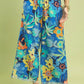 Umgee floral print wide-leg pants with blue flowers and frayed hems