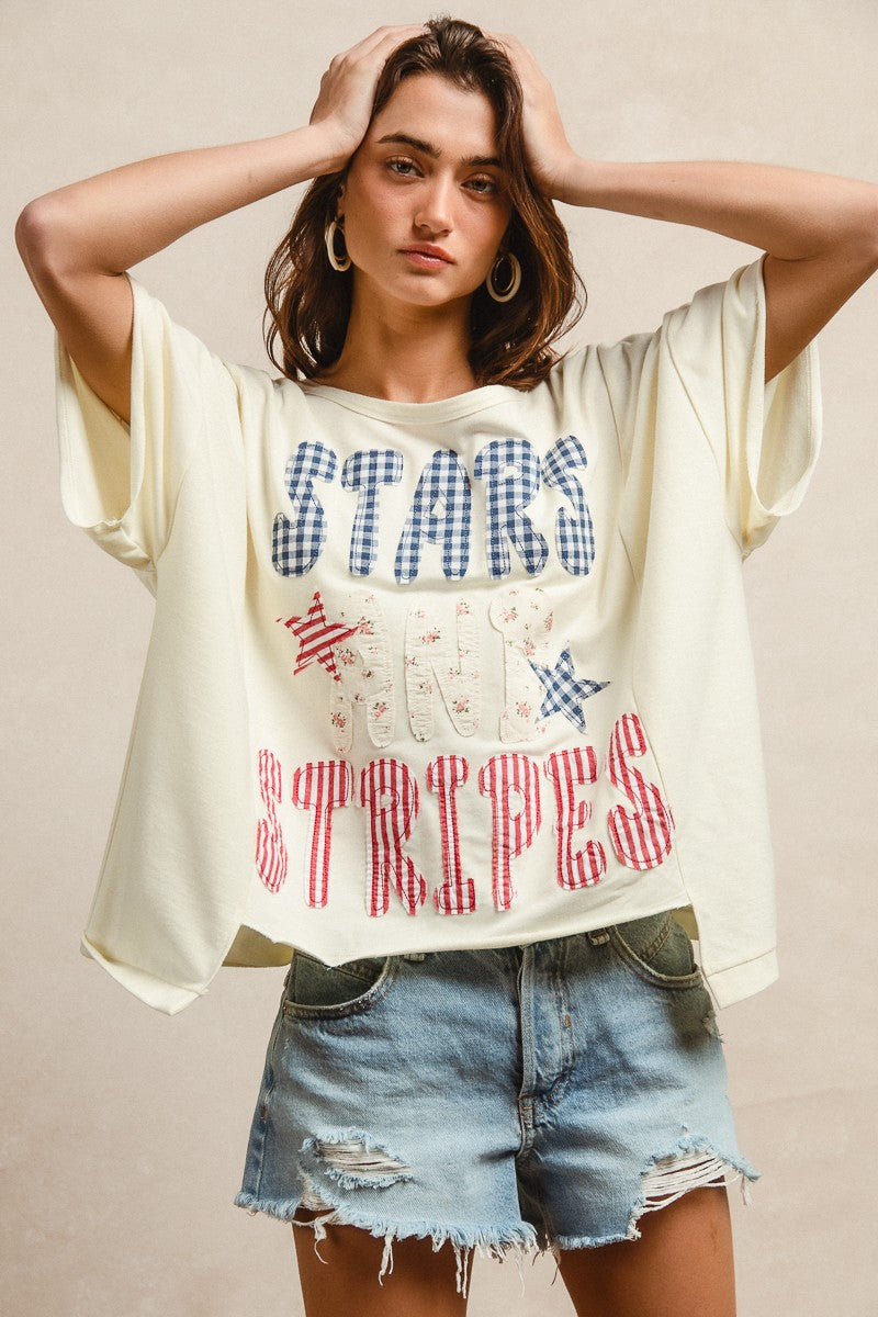 BiBi Mix And Match Stars And Stripes Patchwork Short Sleeve T-Shirt, cream-colored oversized with blue and red checkered, striped, and star patterns
