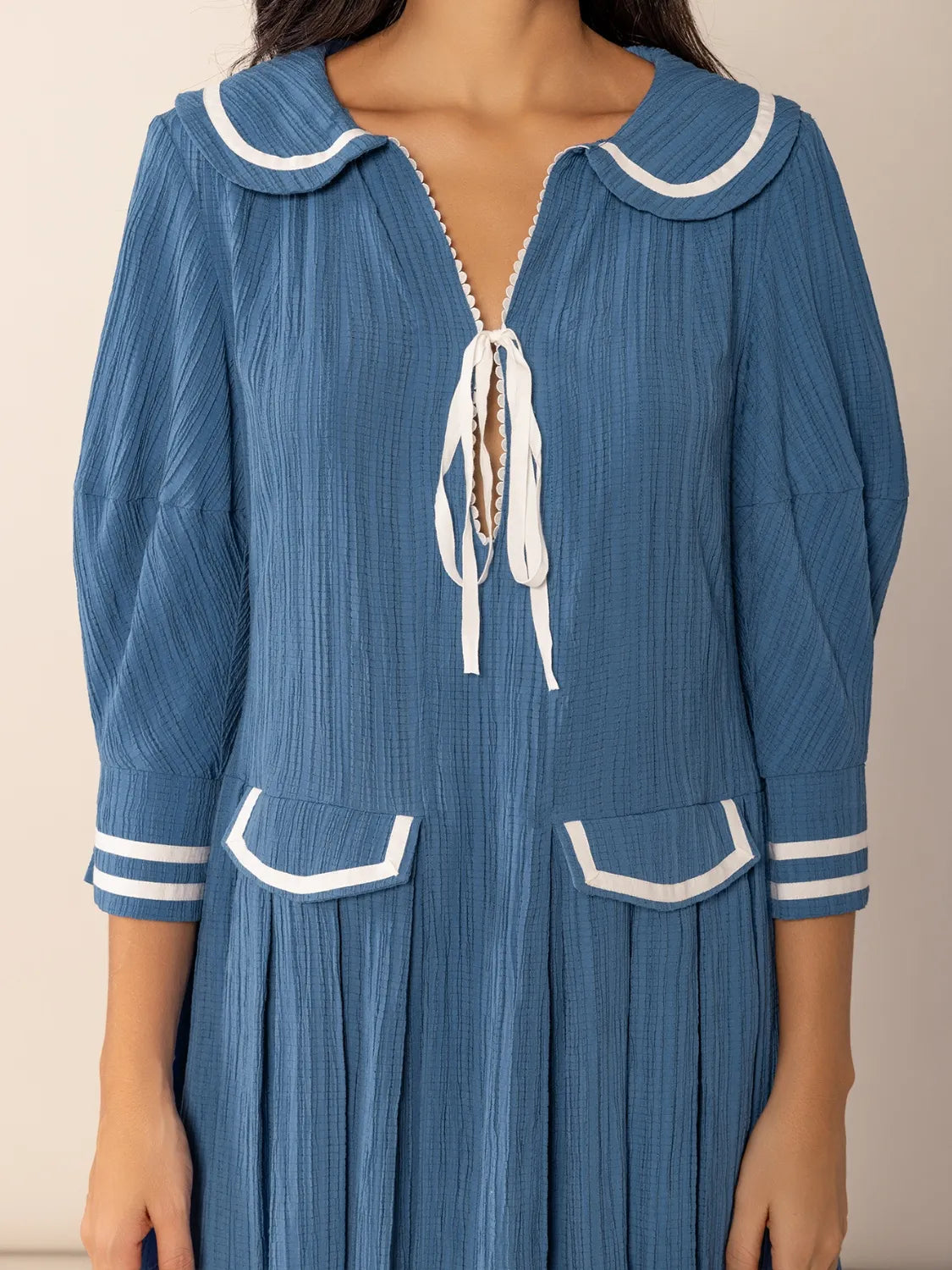 Peter Pan collar tie-front pleated three-quarter sleeve mini dress in blue ribbed cotton with sailor collar and white trim