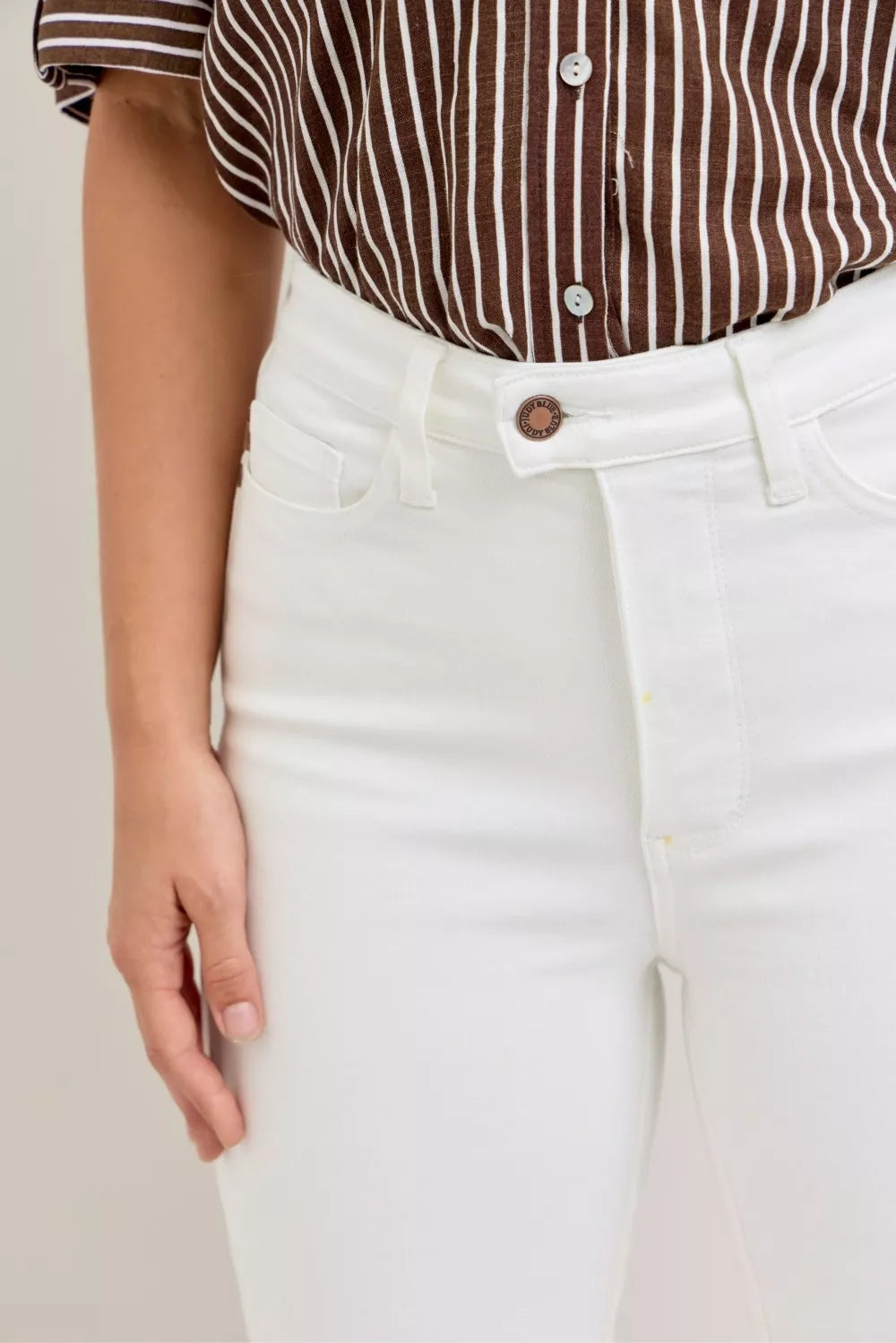 White Judy Blue high-waisted capri jeans with five-pocket design and copper button