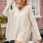 Cream-colored oversized V-neck dropped shoulder ribbed long sleeve sweater