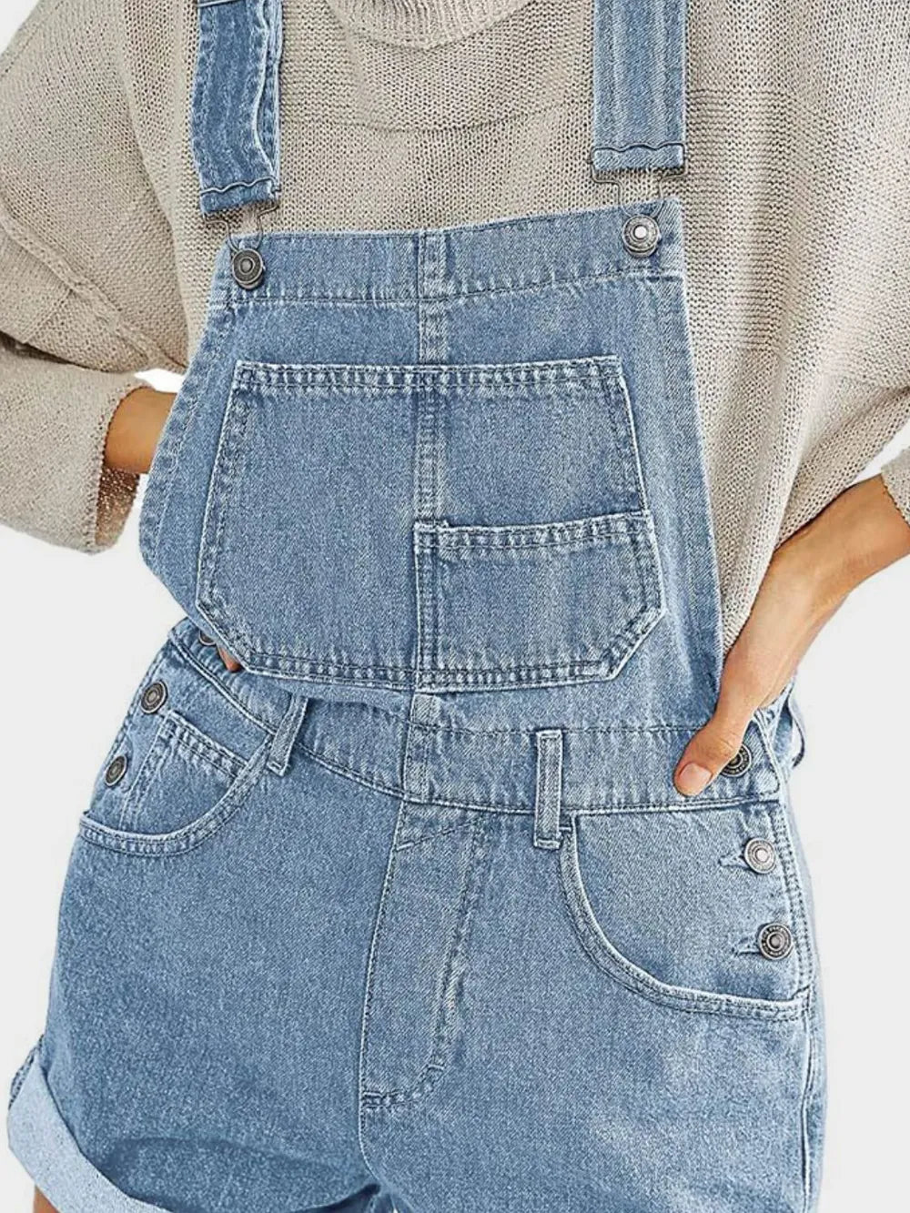 Light-wash denim overalls with square neck, wide straps and pockets