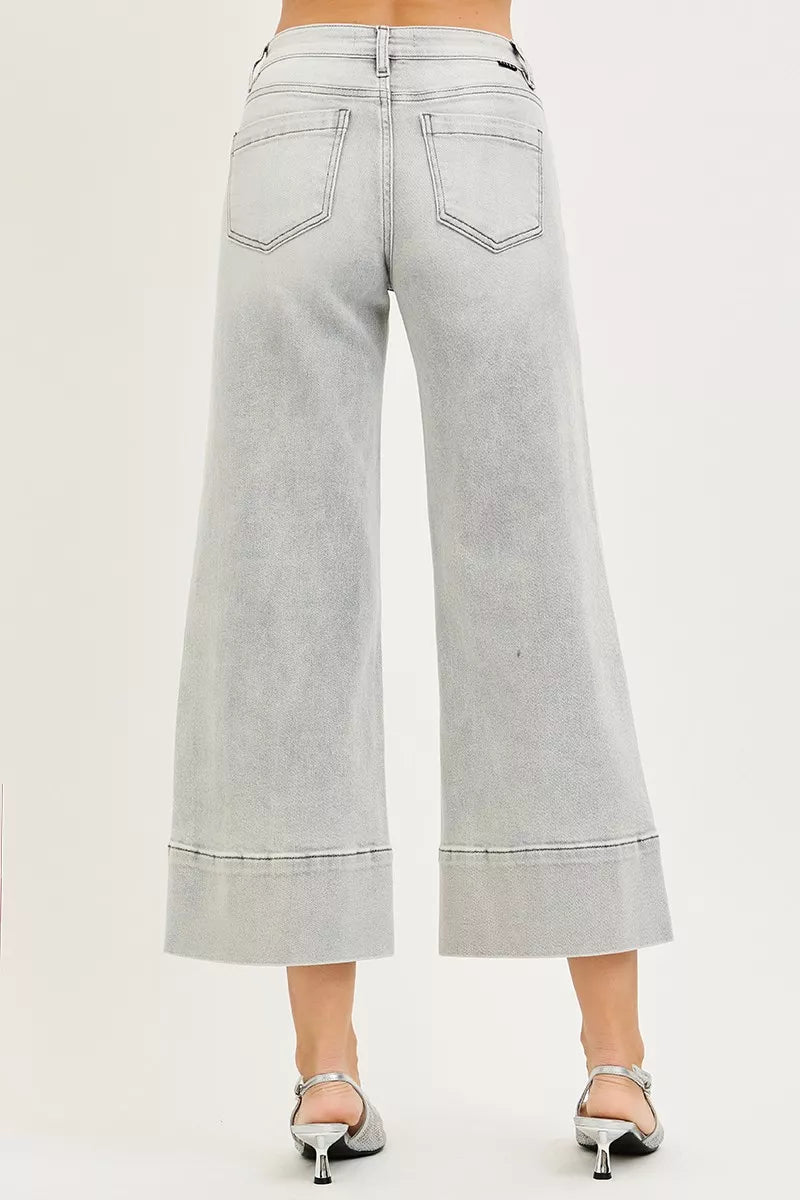 RISEN Tummy Control Mid Rise Crop Wide Pintuck Front Jeans in light-wash denim with rolled cuffs and back pocket