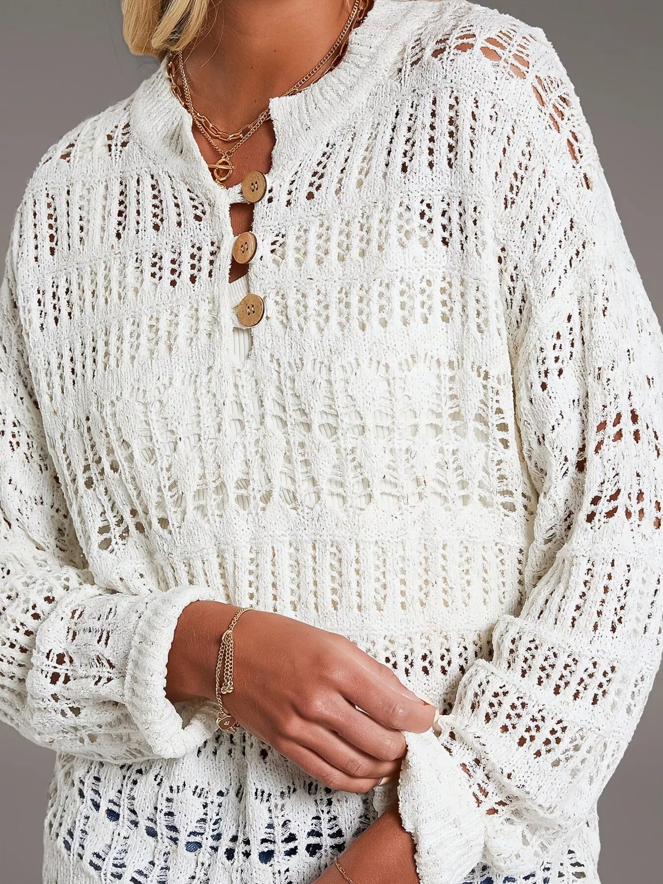 Button-detail knit cover up: white intricately knitted sweater with lace pattern