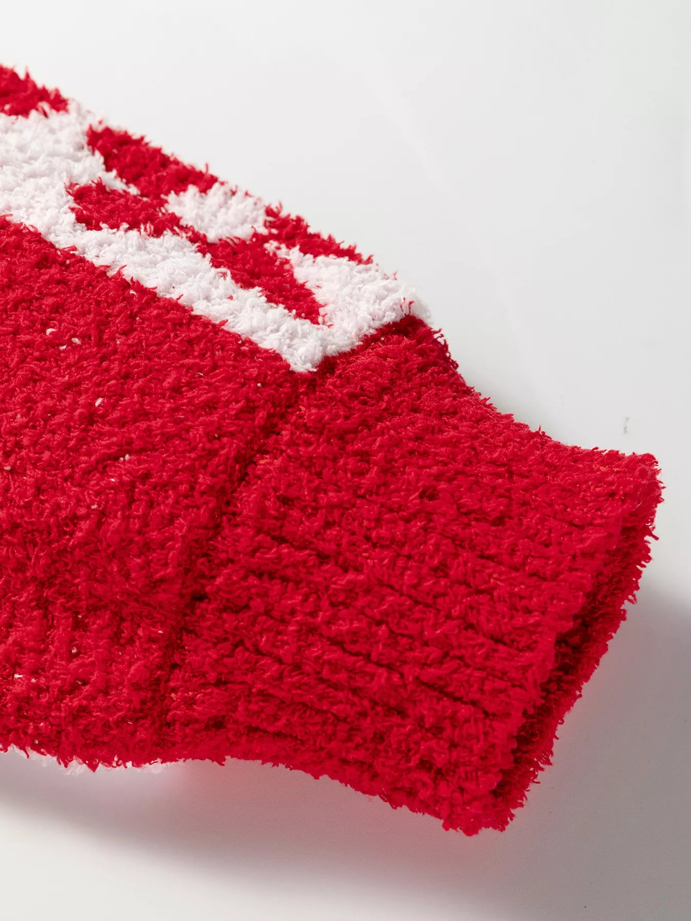Red and white fuzzy knit cuff from Daverri Floral Heart Checkered V-Neck Sweater
