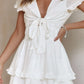White ruffled short mini dress with deep V-neck and tied smocked waistband
