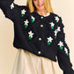 Black Davi & Dani knitted cardigan with white daisy and green leaf accents