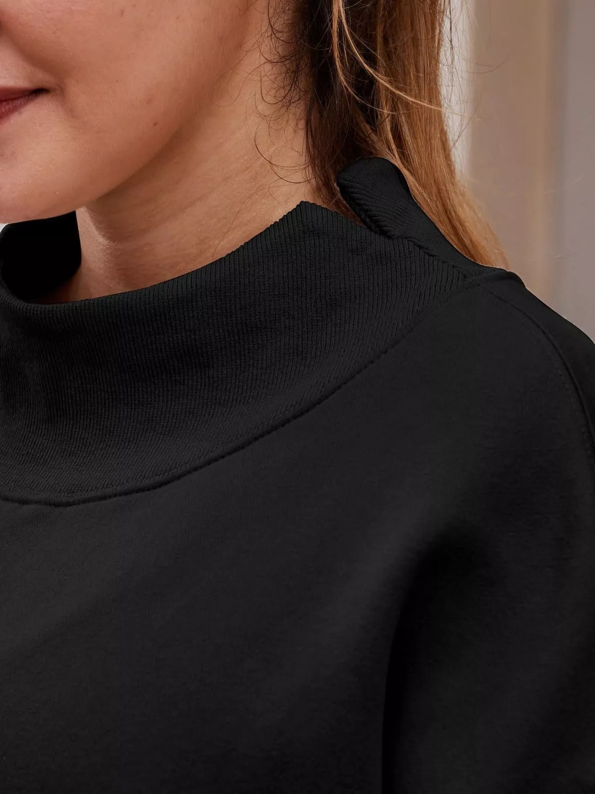 Black ribbed mock neck top in dropped shoulder sweatshirt
