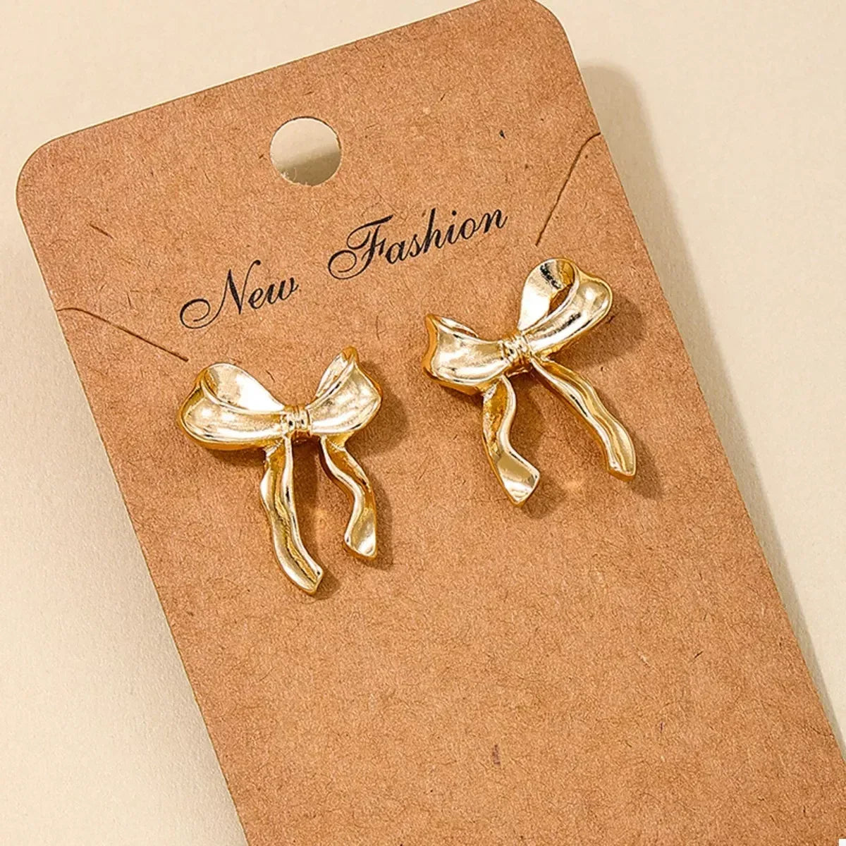18K Gold-Plated Alloy Bow Stud Earrings - DAVERRI FASHIONS