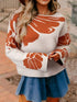 Boho flower pattern oversized knit sweater in cream with rust-orange florals and bell sleeves