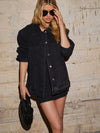 Daverri black denim jacket with silver buttons and rolled-up sleeves