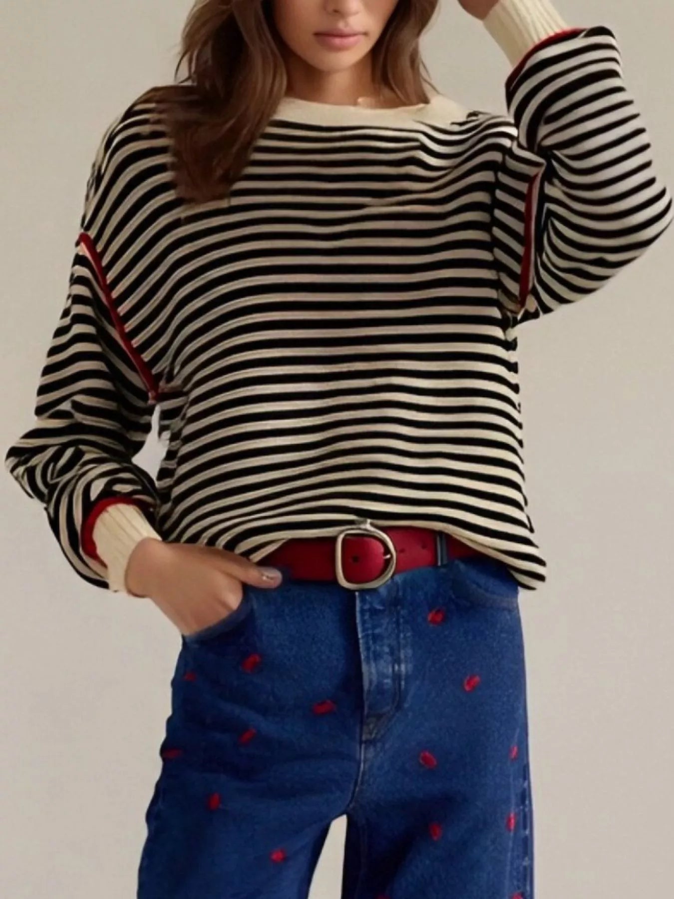Black and white striped round neck long sleeve knit sweater with red trim