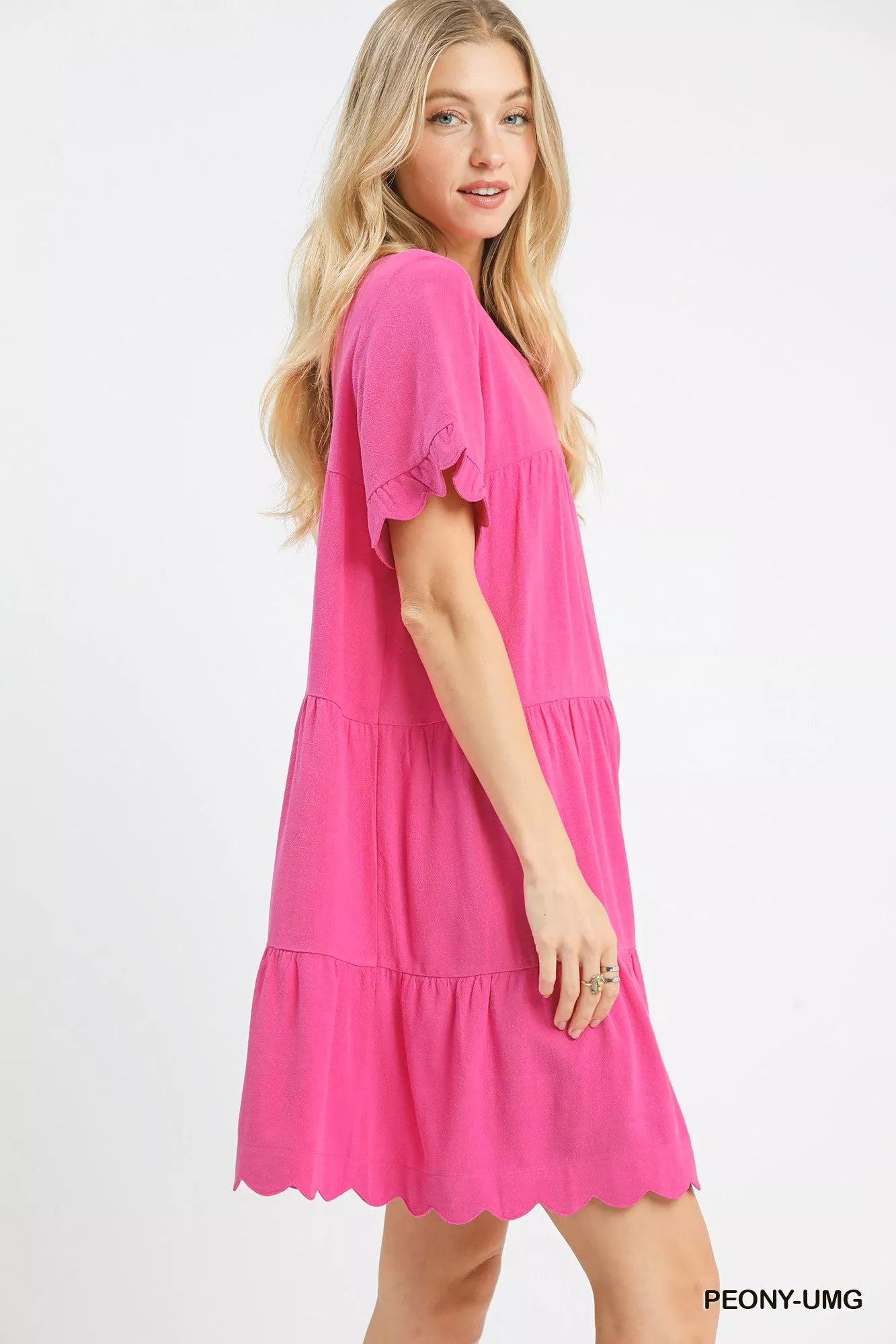 Vibrant pink Umgee linen tiered babydoll dress with ruffle sleeves and scalloped hem