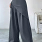 Daverri wrap-front wide-leg pants in dark gray with draped asymmetrical front and side ties