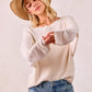 Beige ribbed waffle knit off-shoulder top with long sleeves